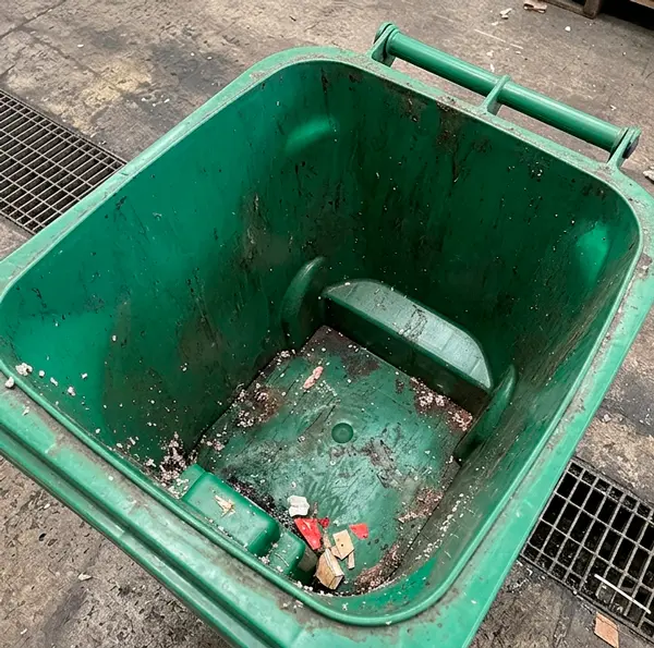 Smelly commercial waste container before professional bin washing treatment in Nevada City